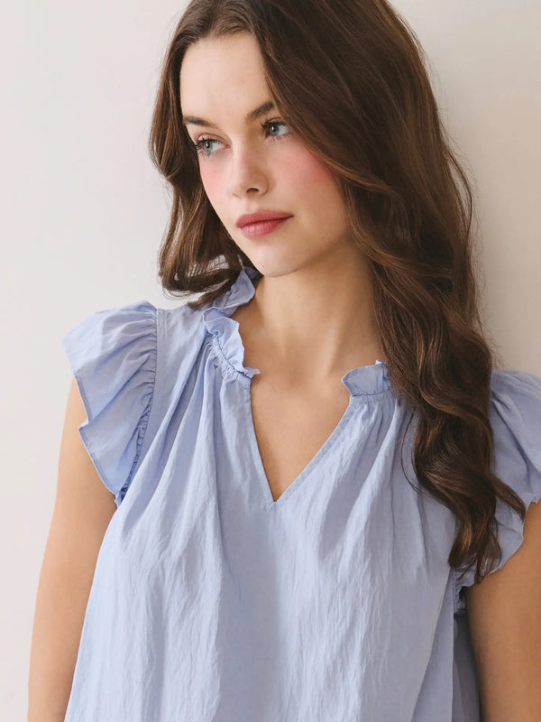 Soft Blue Ruffled Mock Neck Top with V-Notch Detail